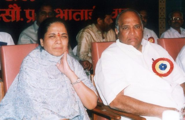 Sharad Pawar seated with his wife at a public event
